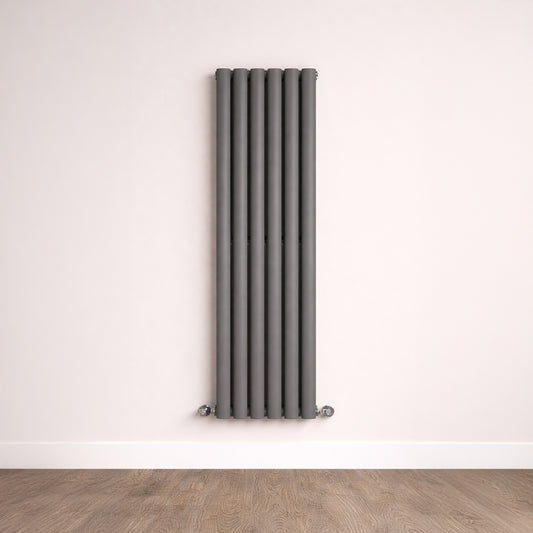 Vertical radiator on a white wall with wooden floor
