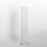 DOUBLE_OVAL White vertical radiator on a light gray background