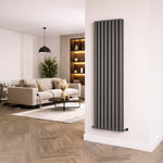 Modern living room with a vertical radiator on a white wall.