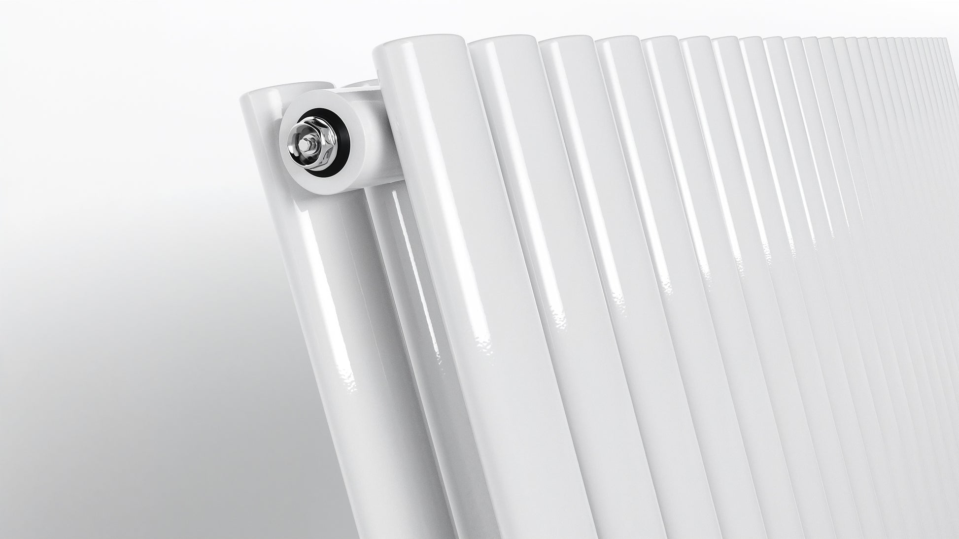 Close-up of a white radiator on a light gray background
